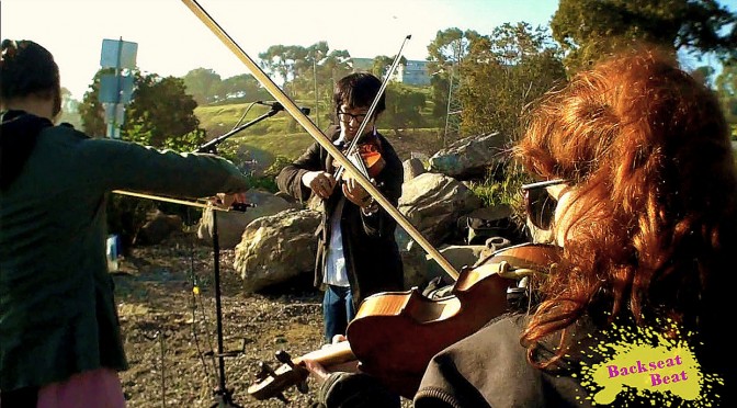 The string section of The Definite Articles in full effect