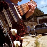 Hot shot of Eva's guitar + Lulu, our trusty Volvo